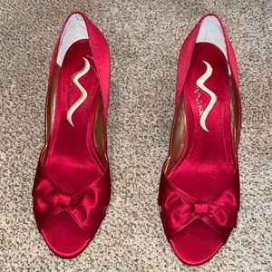 Brand NEW red heels. Made by Nina.